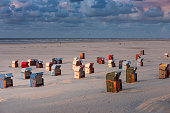 istock Germany, Lower Saxony, East Frisia, Juist, beach baskets in the evening light. 1158635900