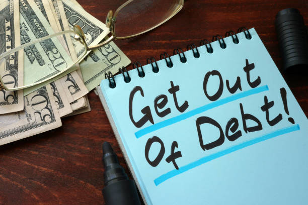Get out of Debt written on a notepad with marker. Get out of Debt written on a notepad with marker. relief carving stock pictures, royalty-free photos & images