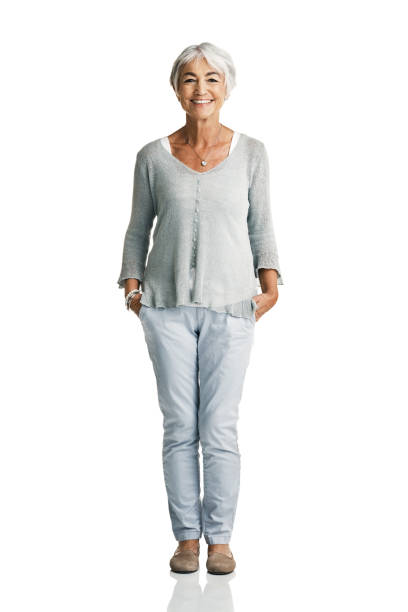 Getting older doesn't mean life's over Studio portrait of a senior woman posing with her hands in her pockets against a white background full length stock pictures, royalty-free photos & images