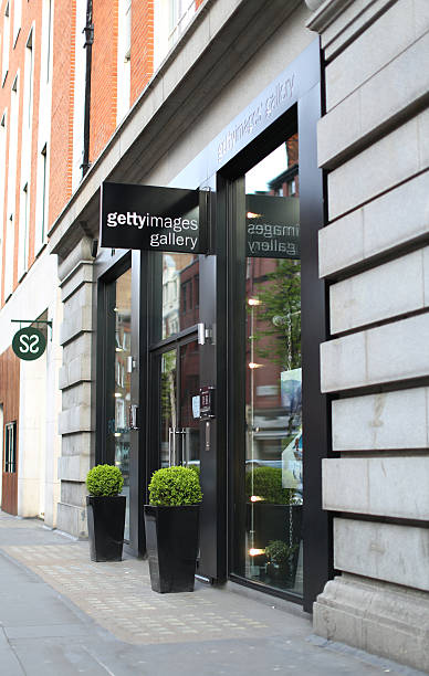 Getty Images Gallery London London, UK - May 1, 2016: The front entrance to Getty Images Gallery in London, UK. Eastcastle Street is reflected in the window. getty images stock pictures, royalty-free photos & images