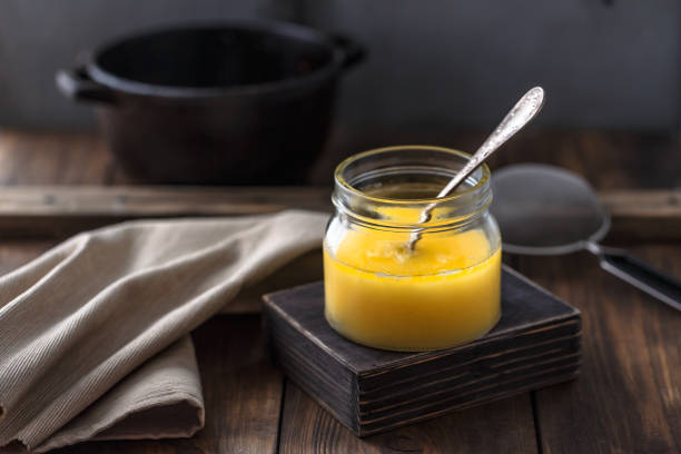 Ghee or clarified butter in a jar. Ghee or clarified butter in a jar ghee stock pictures, royalty-free photos & images