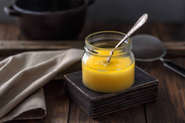 Ghee or clarified butter in a jar. stock photo