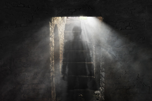 A picture of an old dusty cellar and ghostly figure in it