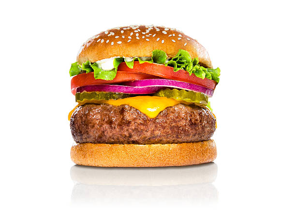 Giant perfect burger large massive thick classic american cheeseburger white Perfect hamburger classic burger american cheeseburger isolated hamburger with sesame seed bun and extra toppings of tomatoes pickles onion and cheddar cheese hamburger stock pictures, royalty-free photos & images