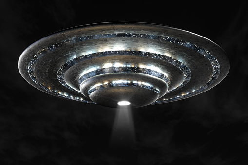 3d rendering of a large ufo at night.