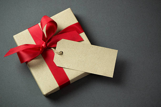 Gift box with empty tag stock photo