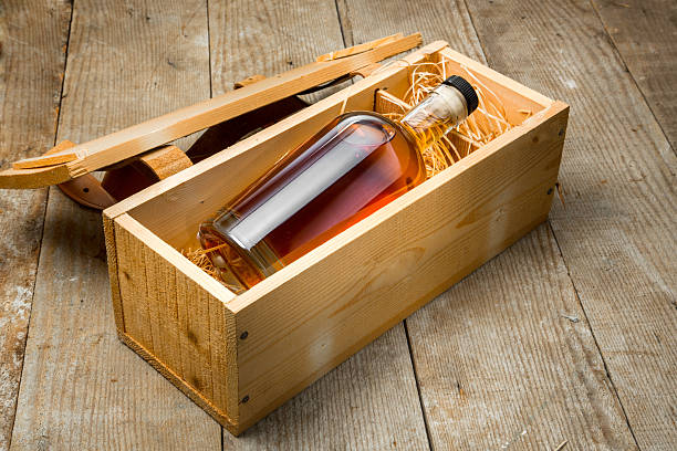 Gift box wooden crate barrel whisky bourbon liquor whiskey bottle stock photo