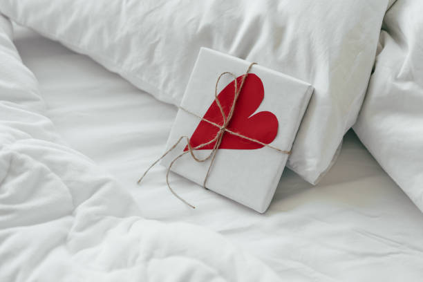 gift for valentines day in bed stock photo