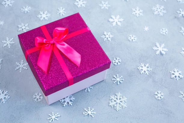 Gift or present box and snowflakes with copy space stock photo