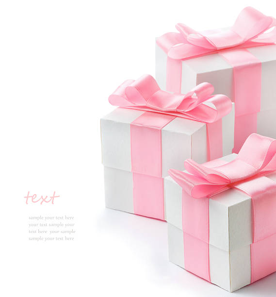 Gift white box with pink satin ribbon stock photo