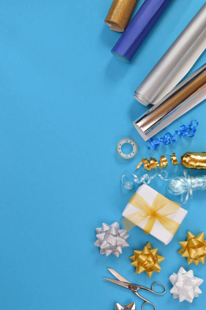 gift wrapping utensils on cyan stock photo