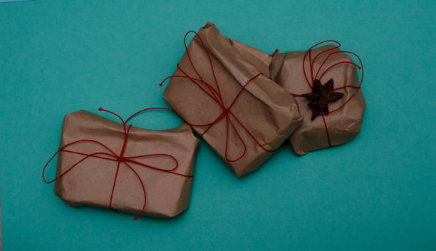 Gifts wrapped with simple red ribbon stock photo
