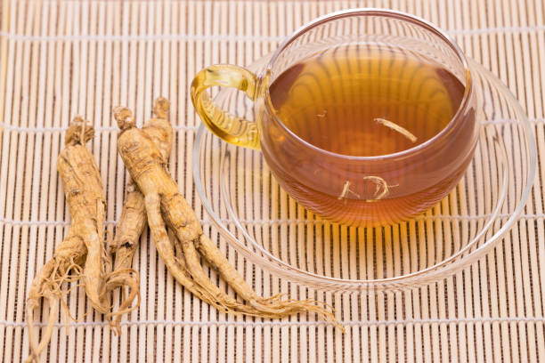 Ginseng tea and Dry Ginseng Roots  ginseng stock pictures, royalty-free photos & images