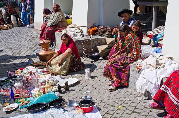 Gipsy selling they goods on the Small Square of Sibiu stock photo