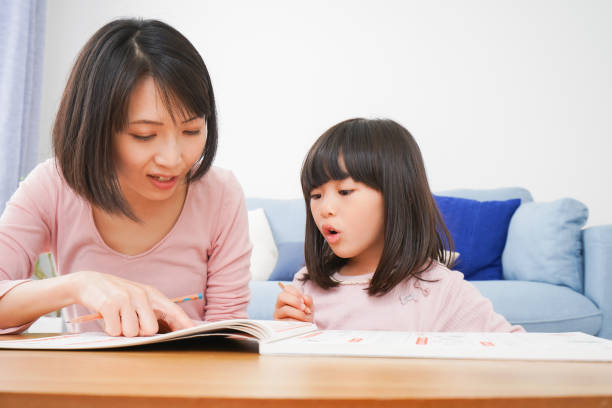 A girl and her mother studying at home A girl and her mother studying at home child korea little girls korean ethnicity stock pictures, royalty-free photos & images