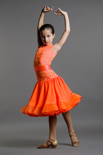 Girl Dancer Ballroom Dancing Poses On A Gray Background