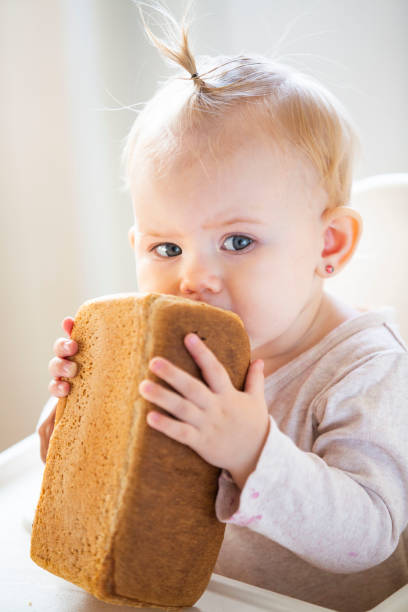 Girl eat bread stock photo