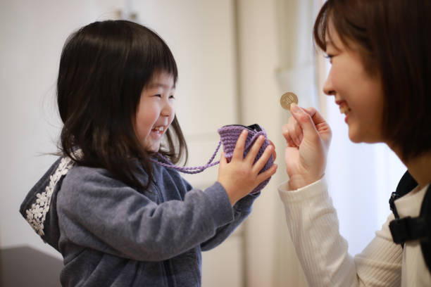 Girl getting pocket money Girl getting pocket money allowance stock pictures, royalty-free photos & images