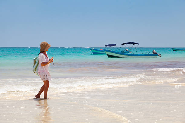 Girl having a walk in Playa Paraiso, Mayan Riviera stock photo