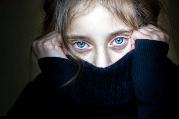 Girl hiding her face. Worried and scared girl hiding her face shock stock pictures, royalty-free photos & images
