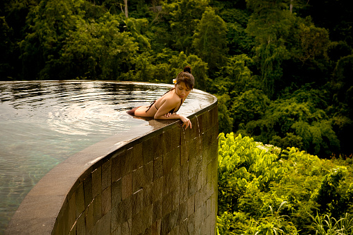 Girl In Pool In Ubud Bali Indonesia Stock Photo - Download Image Now ...