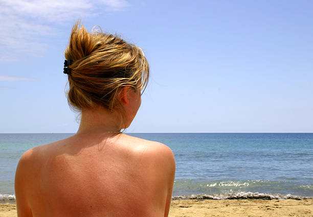 Girl on the beach stock photo