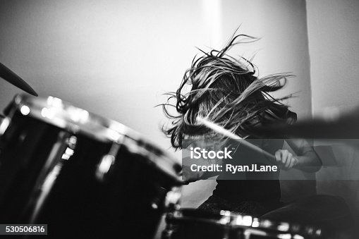 istock Girl Playing Rock and Roll Drums 530506816