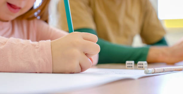 Girl studying in classroom stock photo