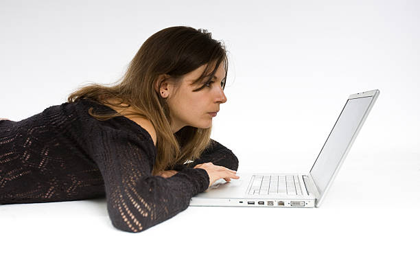 Girl studying on laptop stock photo