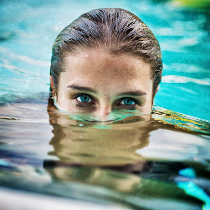 Girl Submerged Underwater With Her Eyes Above The Water Stock Photo ...