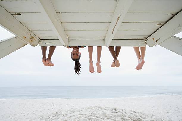 girl upside down - voeten in het zand stockfoto's en -beelden