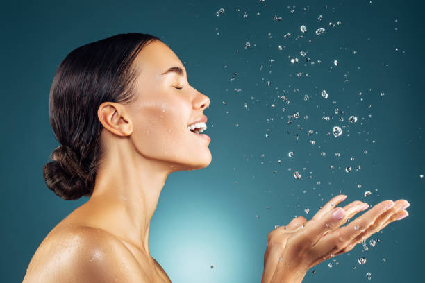 Girl washes her face Girl washes her face beautiful fresh skin stock pictures, royalty-free photos & images