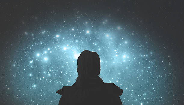 girl watching the stars. stars are digital illustration. - astronomie stockfoto's en -beelden