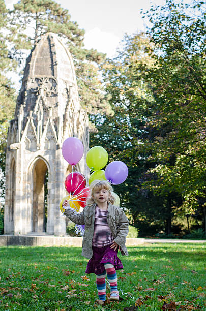 girl with balloons stock photo