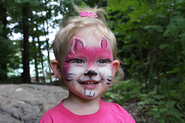 girl with painted face stock photo