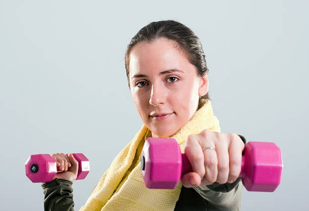 Girl working out with weight stock photo