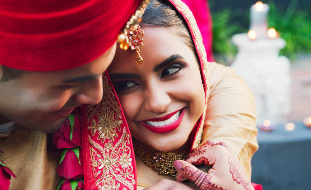 Give love everything you've got Shot of a happy young couple on their wedding day indian bride stock pictures, royalty-free photos & images