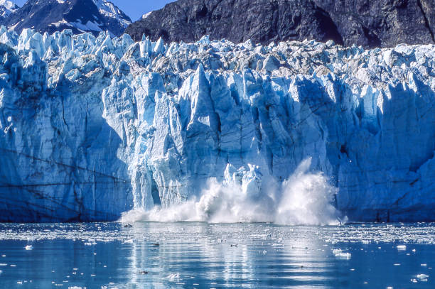 Glacier Calving into Alaskan Bay stock photo