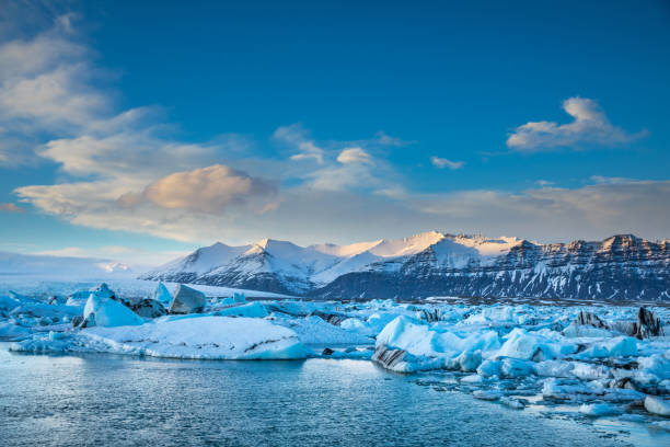 Glacier in Iceland - Blue icebergs floating in the lagoon stock photo
