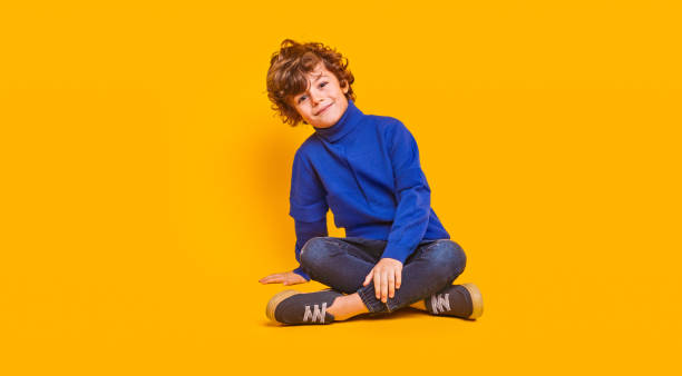 Glad child in stylish clothes stock photo