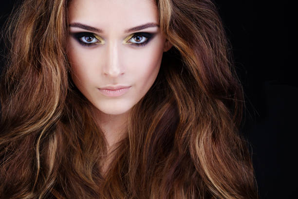 Glamorous Woman With Long Permed Hair And Smokey Eyes Makeup Stock