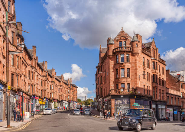 Glasgow, Scotland, Red Sandstone Tenements and Taxi Cab, Sunny Day stock photo