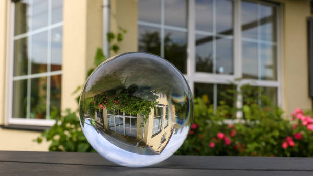 Glass ball photo of a family house (focus middle) stock photo