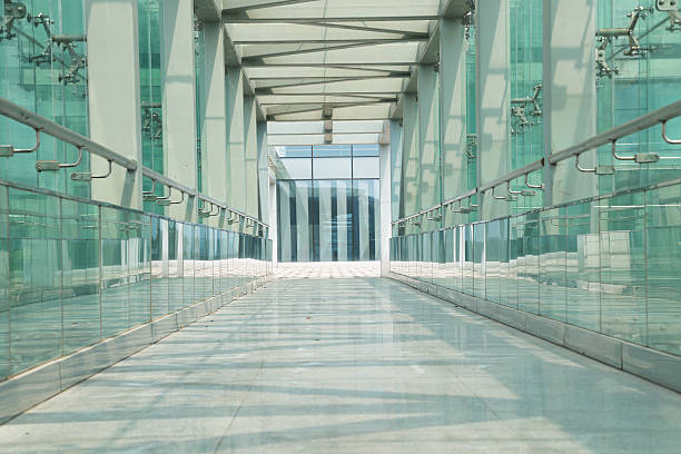 glass corridor in office centre stock photo