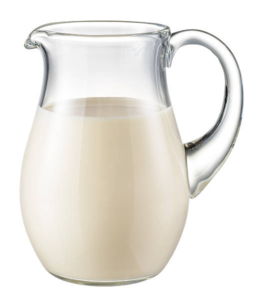 Glass jug of milk isolated on white. With clipping path Glass jug of fresh milk isolated on white. With clipping path jug stock pictures, royalty-free photos & images