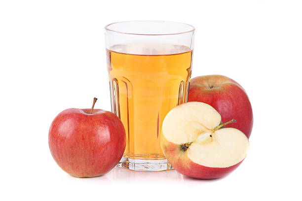 Glass of apple juice Apple juice on white background cider stock pictures, royalty-free photos & images