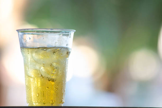 Glass of beer and ice Background image blur. stock photo