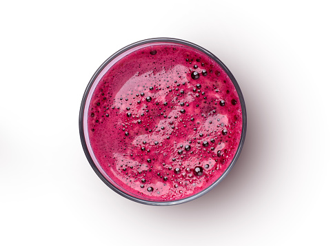 Glass of beetroot (Beet root) juice isolated on white background. Top view. Flat lay.