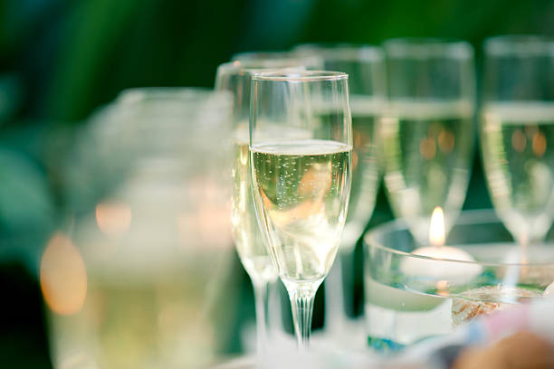 Glass of champagne on the green background stock photo