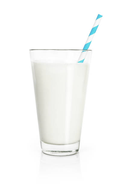 Glass of fresh milk, isolated on white Glass of fresh milk with drinking straw, isolated on white background. Pure milk, soy milk or cow milk, cut out object. straw stock pictures, royalty-free photos & images